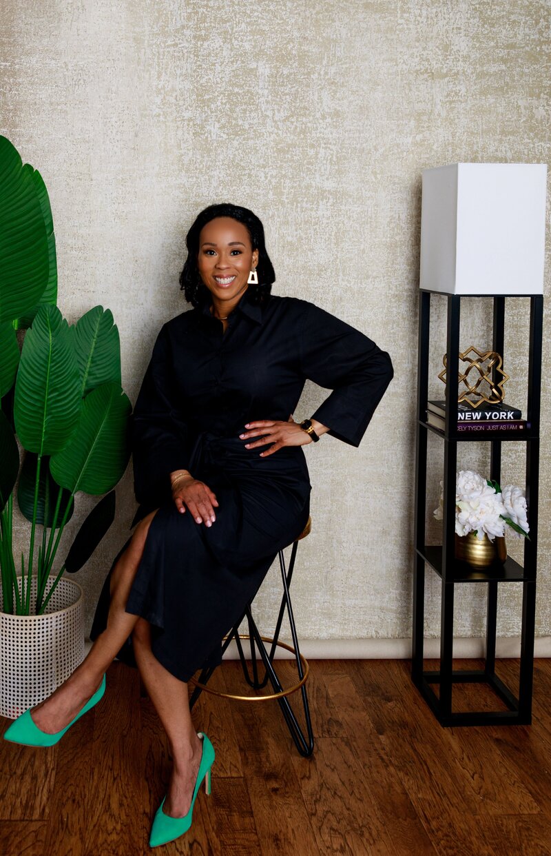 Charmaine Green Forde CEO of Chapter tOO™ sitting and smiling at the camera