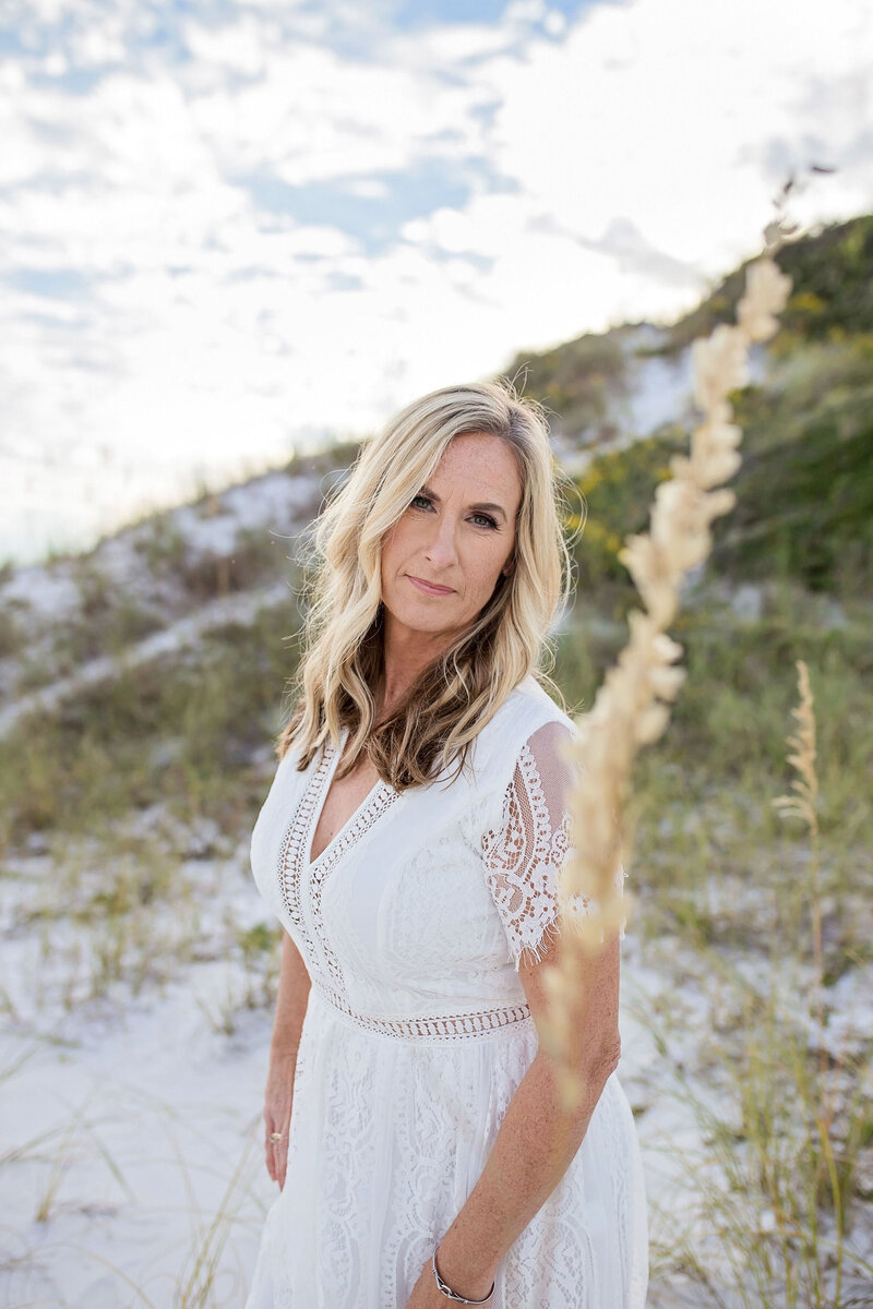 Ann Mangum in dunes at Pensacola Beach