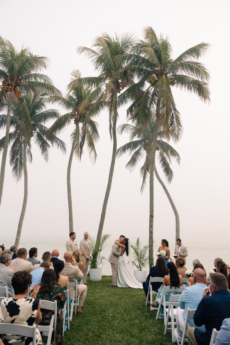 bride and groom smiling and laughing together taken by naples wedding photographer