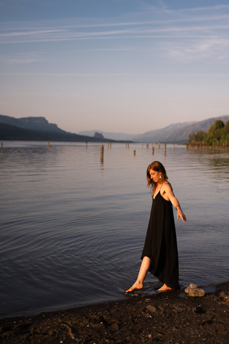 yoga teacher walking along the river