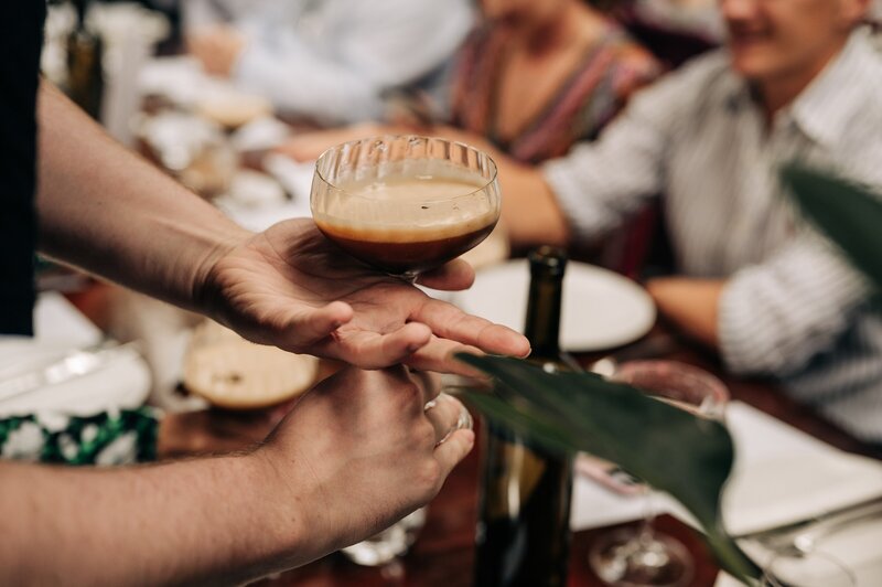 espresso martini being poured at 5th street restaurant during a wedding reception