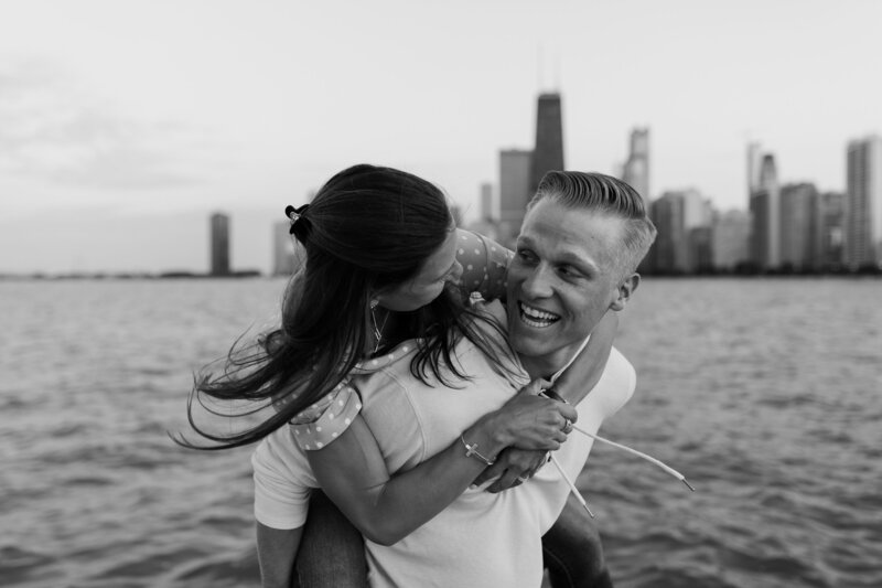 man giving woman a piggy back ride