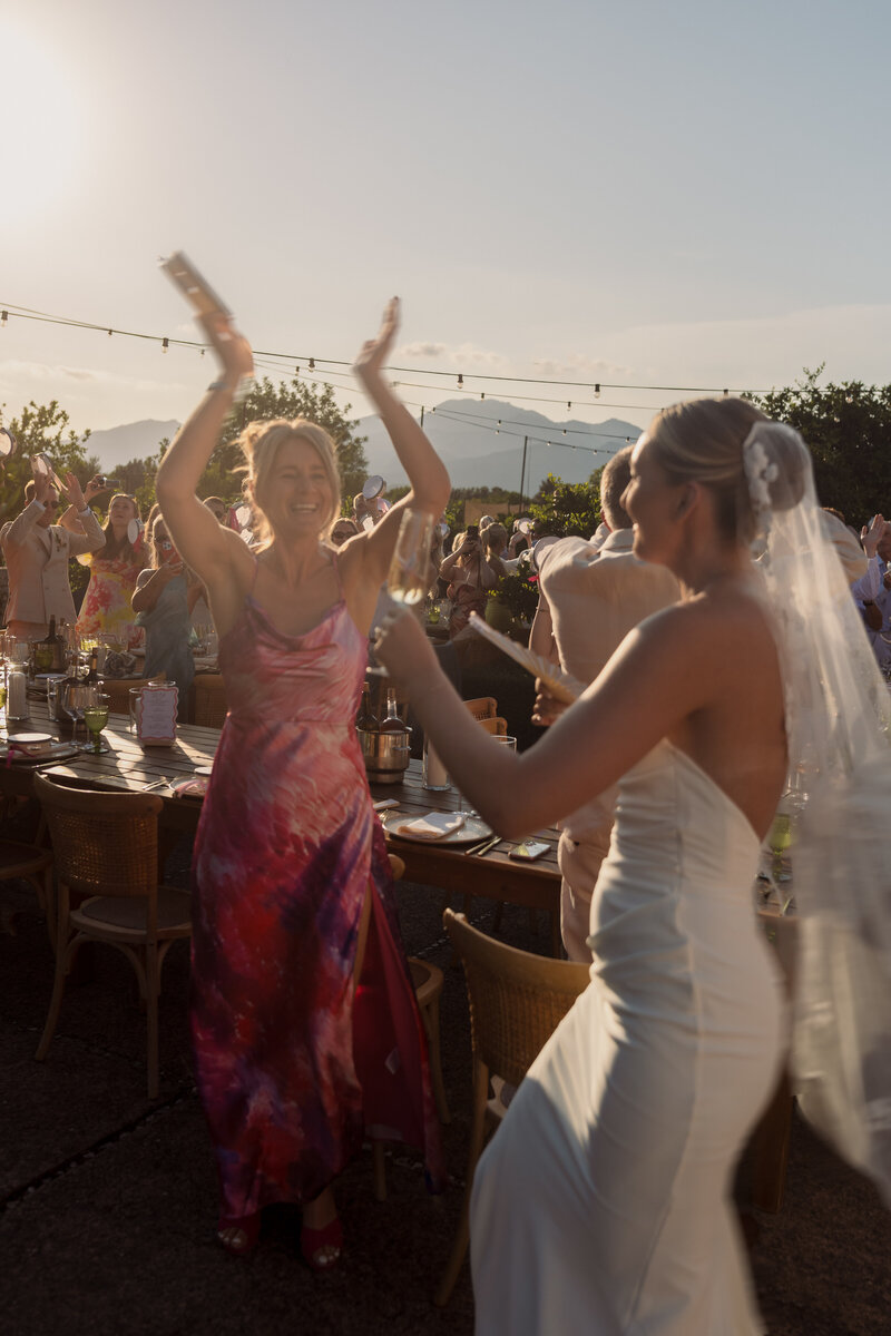 Wedding photographer captures couple taking a stroll hand in hand at their french chateau wedding.