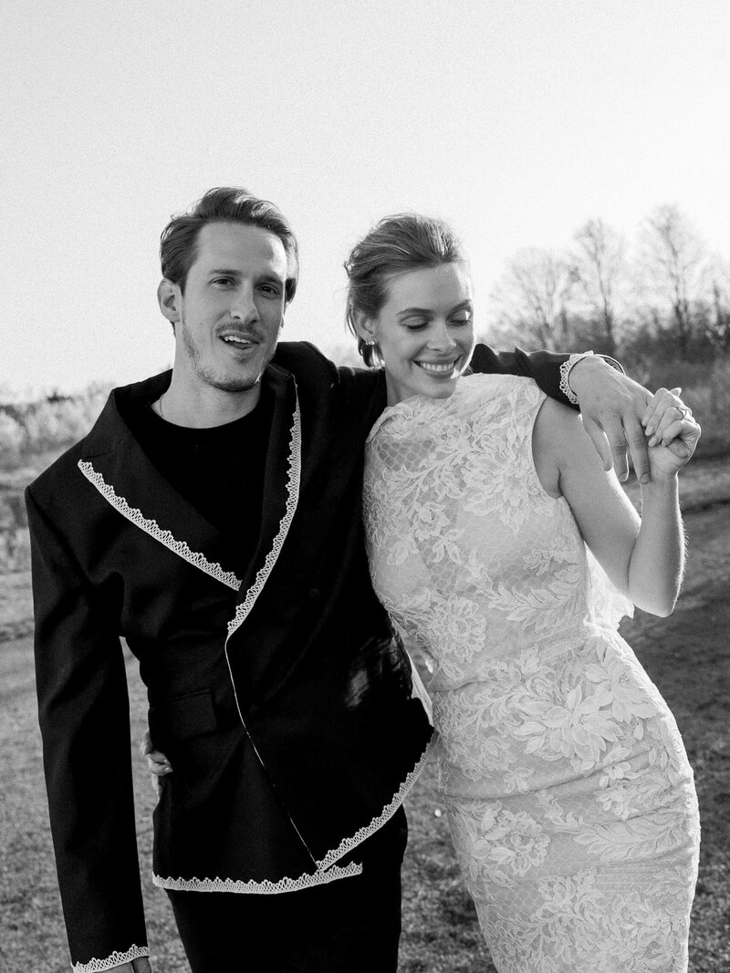 Bride in Danielle Frankel gown at Wildflower Farms in the Hudson Valley with groom in Bode