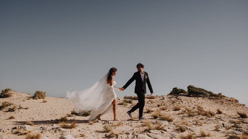 Bride and Groom walking while holding hands in Red Hill after their Mornington Peninsula Wedding