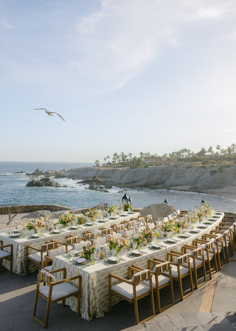 wedding reception tables set up beachside