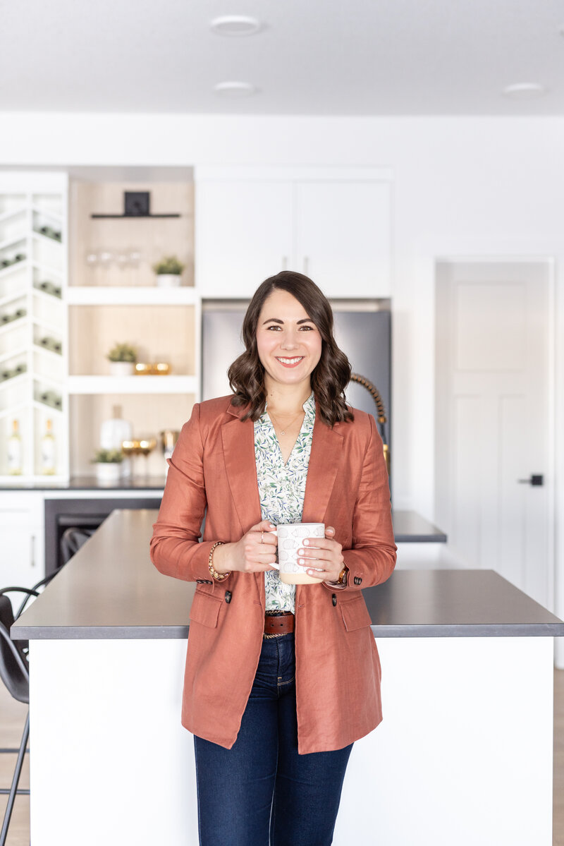 woman sitting on the floor smiling at the camera
