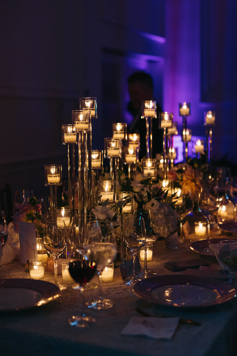Reception tabelscape covered in candles and florals for a couple's wedding day in North Carolina, by Andrea-Marie Photography