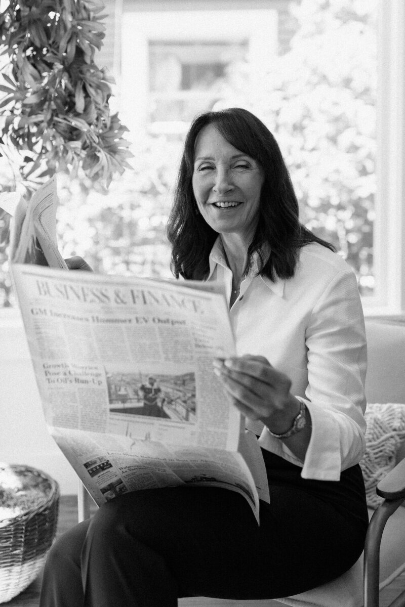 Seattle realtor portrait reading the newspaper