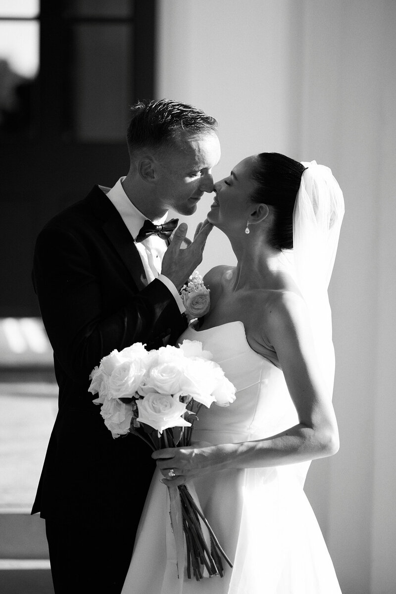 a bride and groom kissing on their wedding day at mount hope farm in Bristol Rhode Island