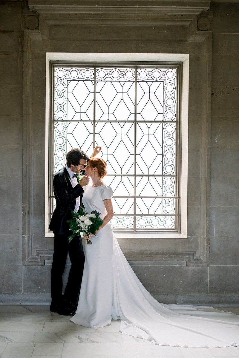 Tiffany Longeway Photography captures an elegant and timeless wedding portrait at San Francisco City Hall.