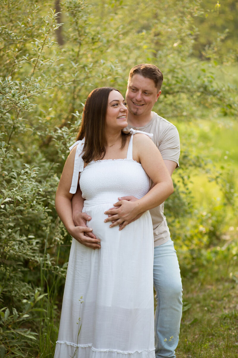 Couple posing for maternity Photography in Shelby Township MI