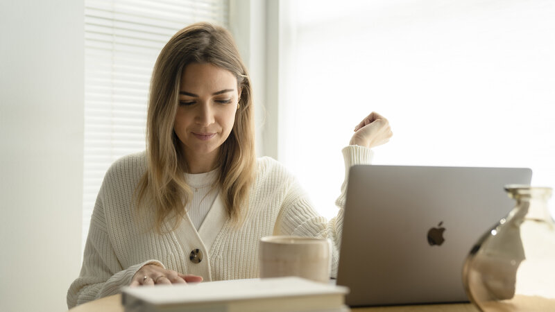 Woman working on her computer.