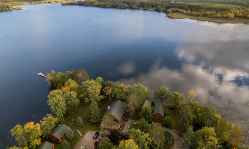 A picture of a beautiful Scandinavian style cabin at ROAM adventure basecamp during the fall in Wisconsin