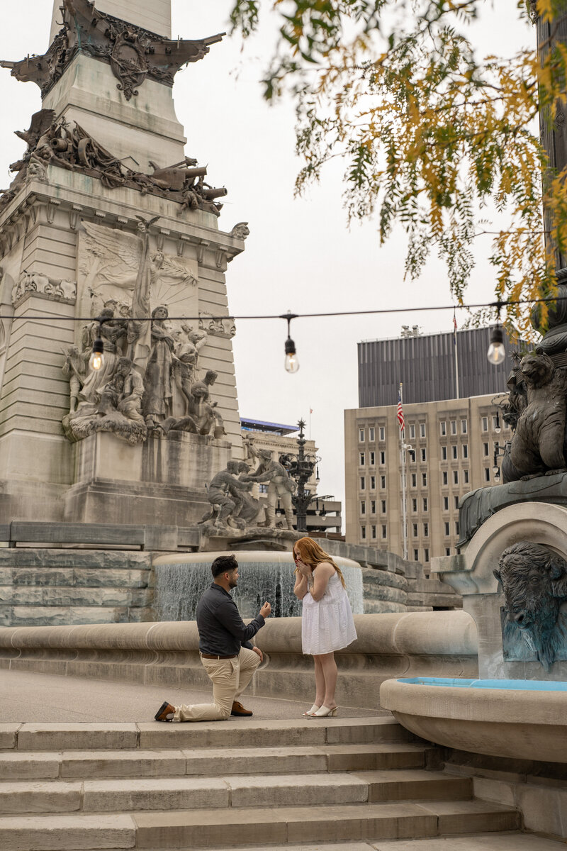 Surprise proposal on the steps of Monument Circle in downtown Indianapolis