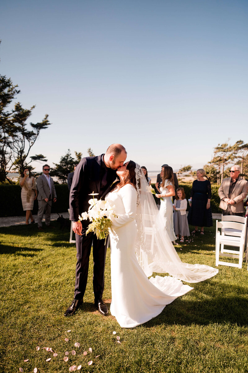 Bridal couple kissing at Seabrook, Washington Coast