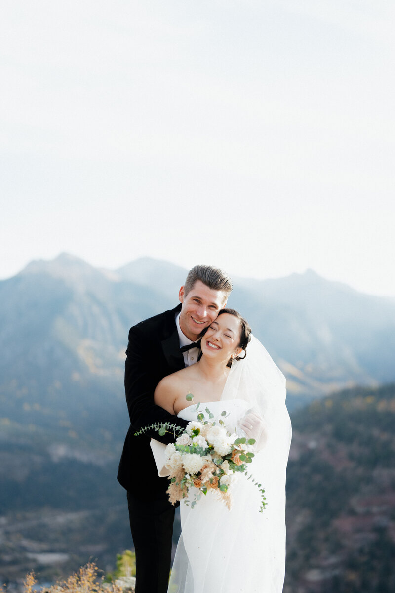 Natural, candid wedding portrait with couple laughing during golden hour | Aspen wedding photographer