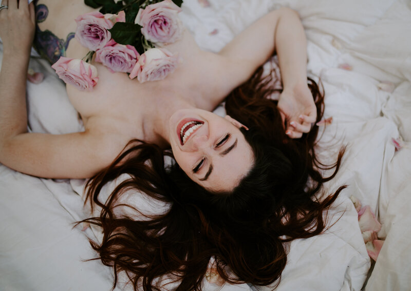 Bride laughing joyfully in a bright, airy setting, captured by an Oregon Coast Elopement and Wedding Photographer.