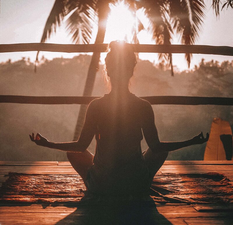 Person sitting mediating at sunset - Heather Stewart Coaching - The Thriving Life Method