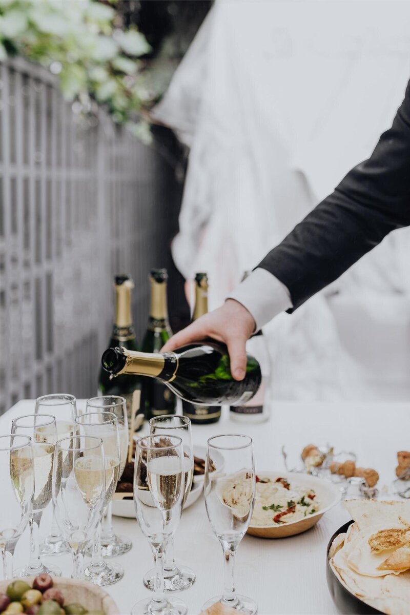 kaboompics_pouring-champagne-into-glass-7917