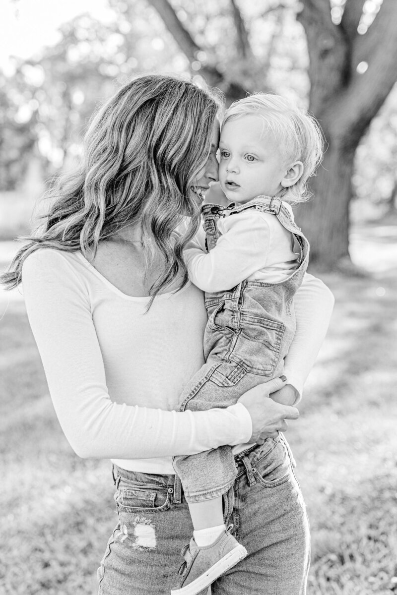Mom holding son and leaning her forhead against him at Columbus County Park