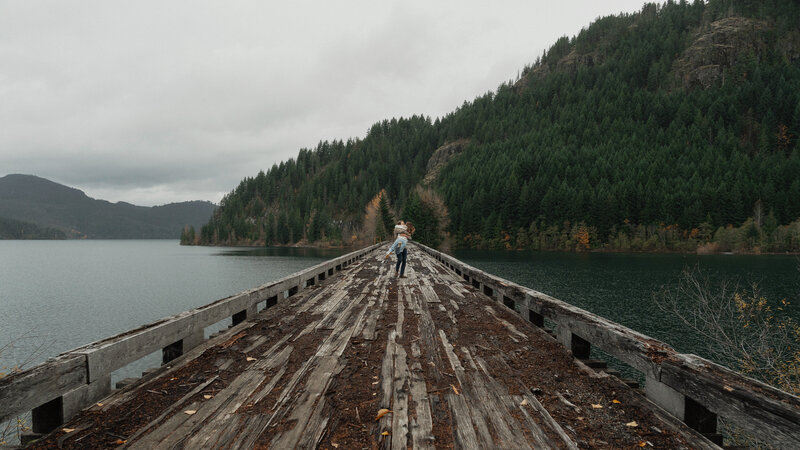 Couple on a trestle bridge in Campbell River during their engagement session by latitude 49 photography