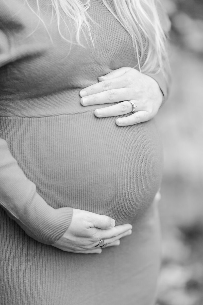 Mom's hands on belly at Opelika maternity session