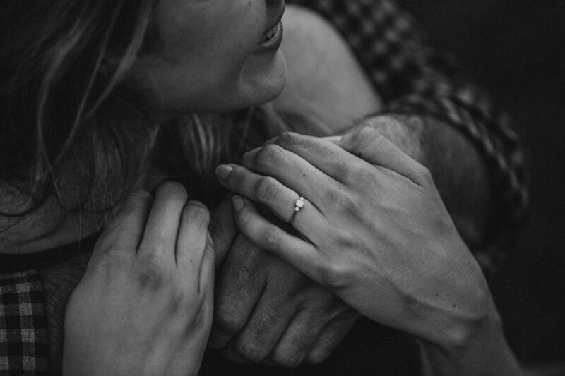A woman with her fiance's arms around her in Charleston, West Virginia