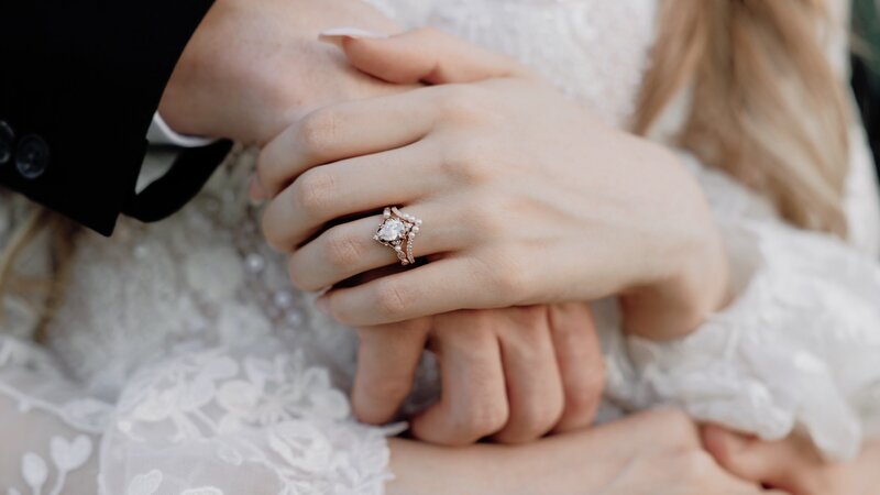 Couple holds hands for wedding ceremony