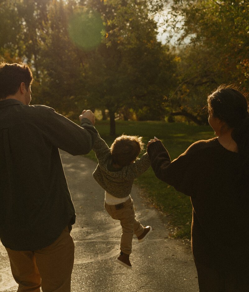 A close up of young girl looking out a window.
