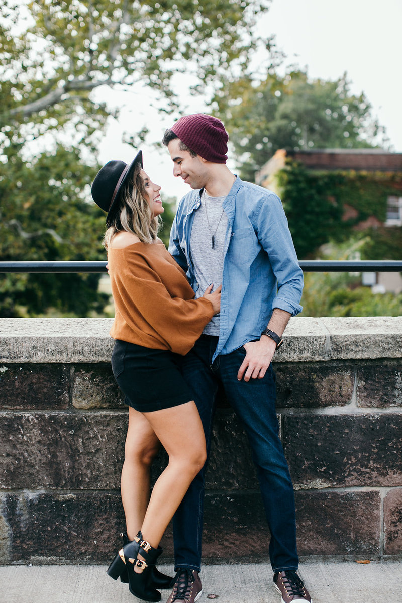 couple stares at each other in love at the park