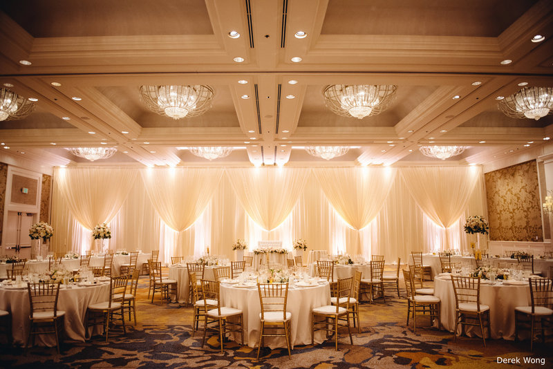 WM Four Seasons Ocean Ballroom ivory matte satin linen pipe & drape gold chiavari chairs wedding