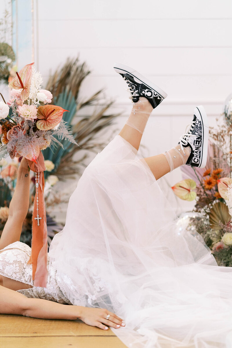 Luxury wedding  image of bride and  her shoes photographed by a Texas film wedding photographer and edited by private photo editors Cultivated Edits