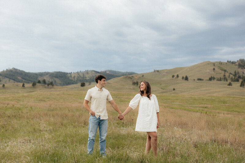 A couple holding hands.