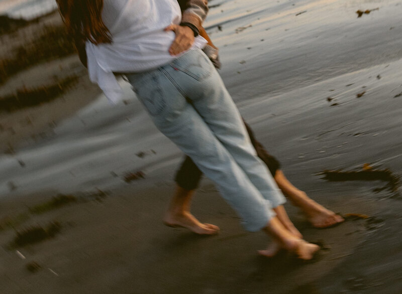 couple holding each other on the beach