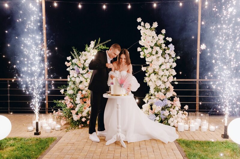 A bride and groom hug after their wedding ceremony captured in by wedding photographer.