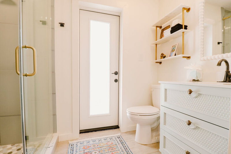 bathroom with walk in glass shower, white vanity sink