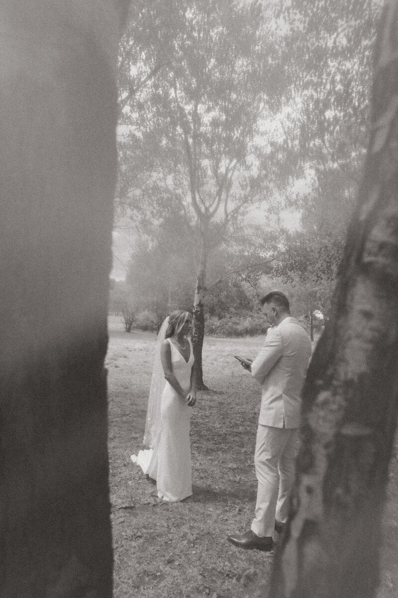 Whimsical mountain wedding vow exchange.