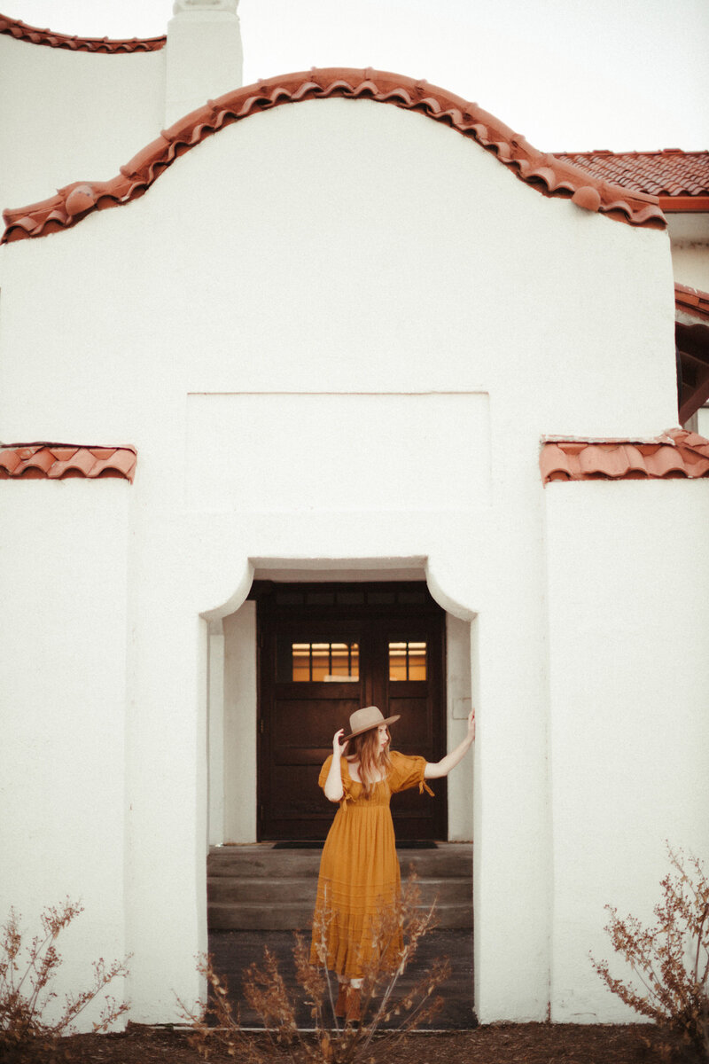 Girl with a hat is posing for photos at the kansas masonic home - Ashley Cole Photography