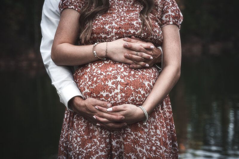 Photo of a couple expecting their newborn during the fall