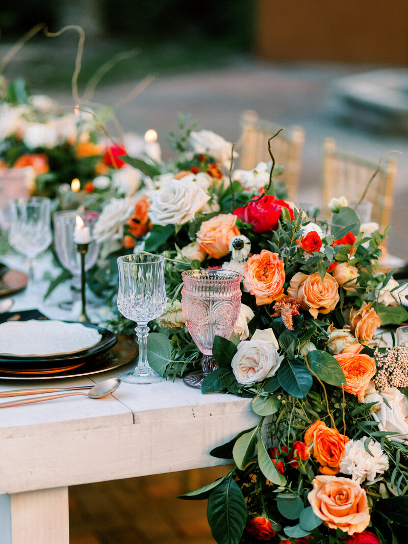 orange and white floral arrangement on a table