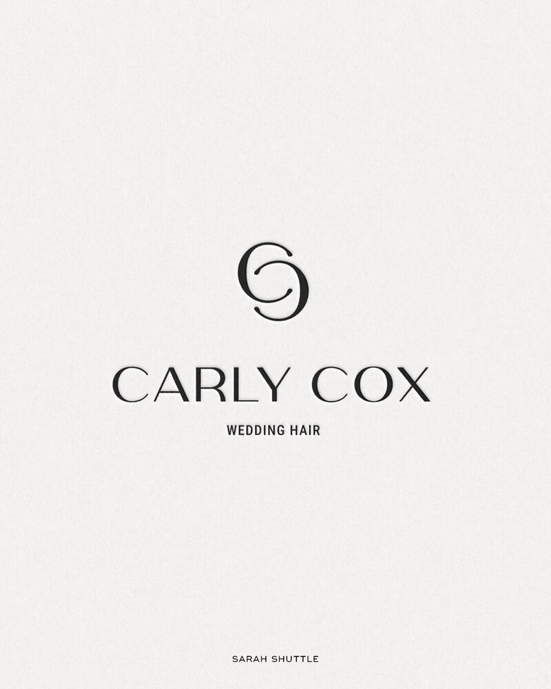 Black Carly Cox logo printed on elegant ivory paper — reflecting timeless brand style