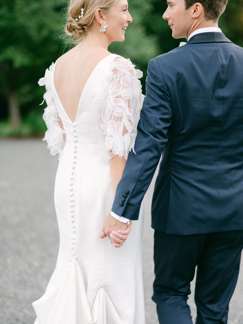 Couple hold hands at their Topnotch resort wedding in Stowe, VT.