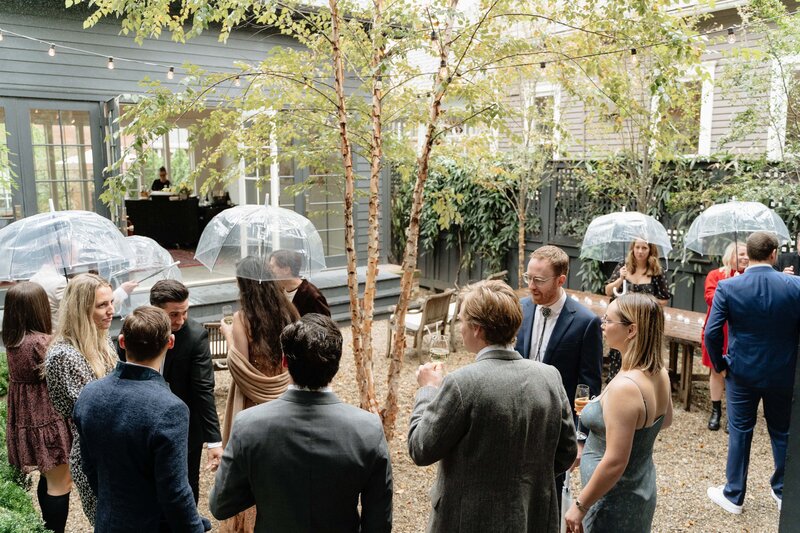 wedding guests waiting in the rain for the ceremony to begin in germantown in nashville