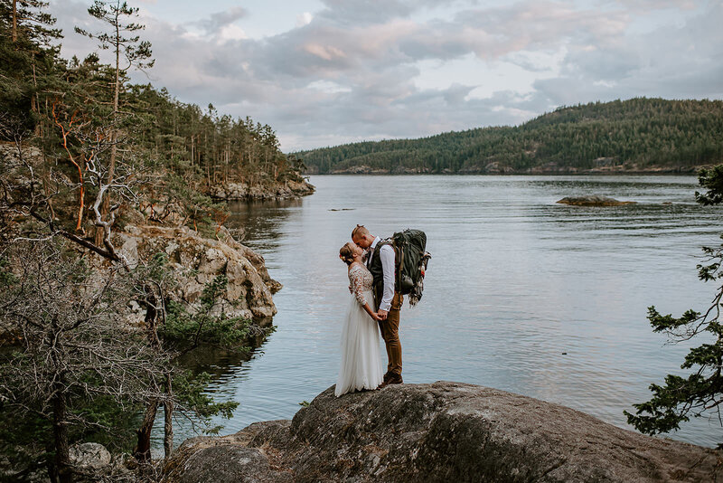 Couple kissing on their dike during their elopement.