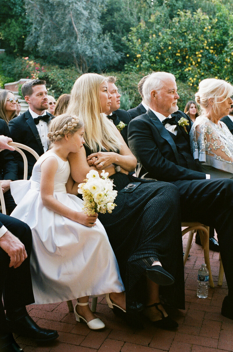 bride and groom walking on porch with plants