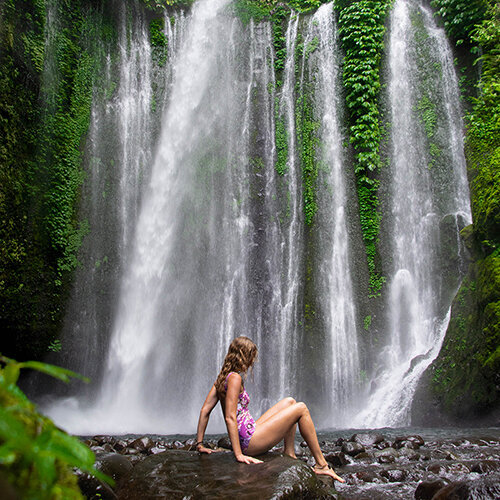 Micaela exploring a waterfall in Lombok, Indonesia