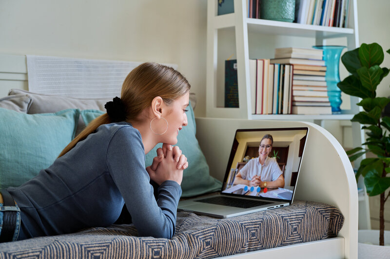 Individual connecting with Amarillo-based Christian therapist via laptop.