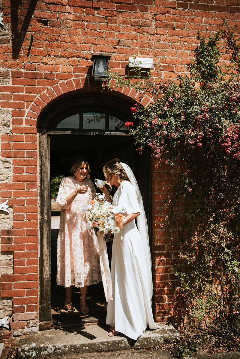 Bride leaving Broadfield Court having a cup of tea