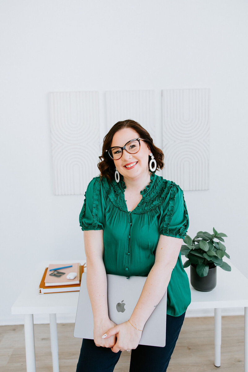 Pens, cell phone, and AirPods on a copywriter's desk